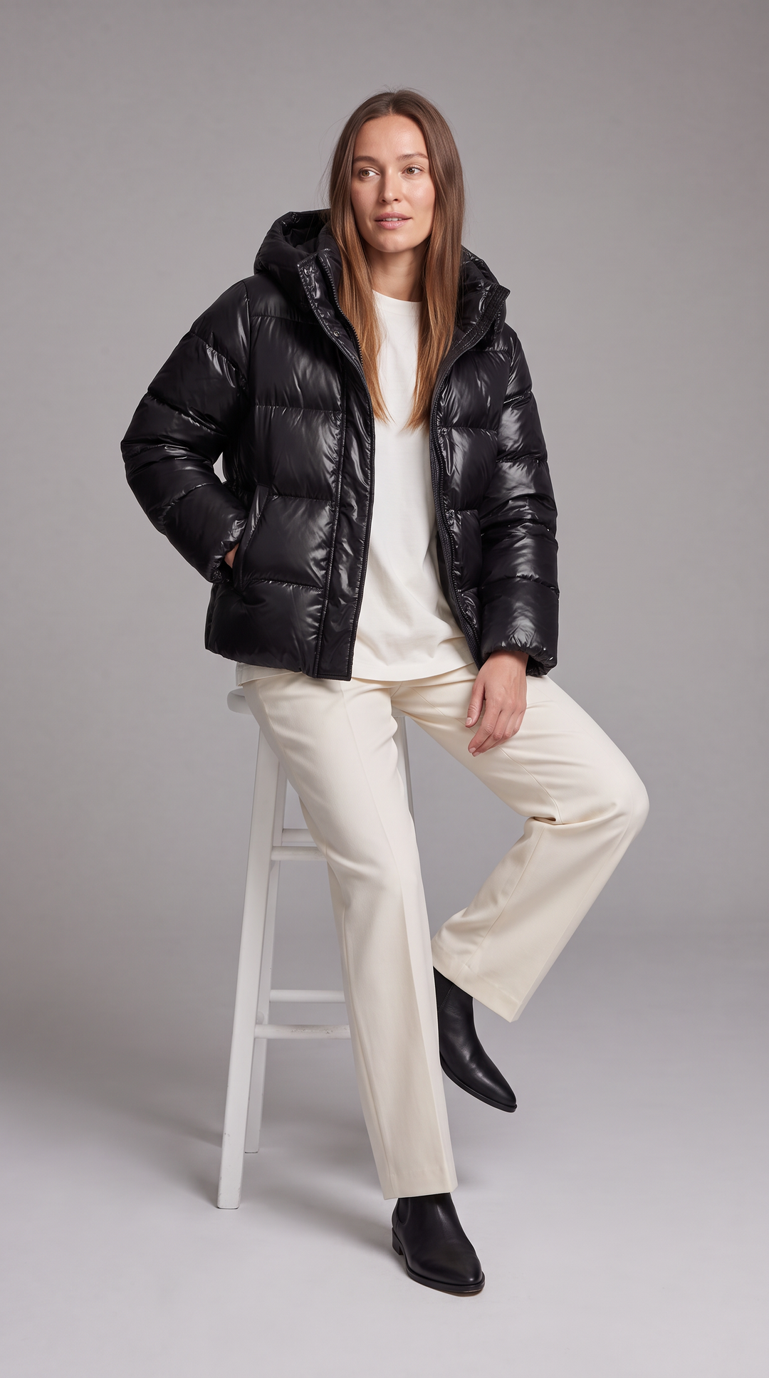 Women's hooded quilted puffer coat with long sleeves and front zipper