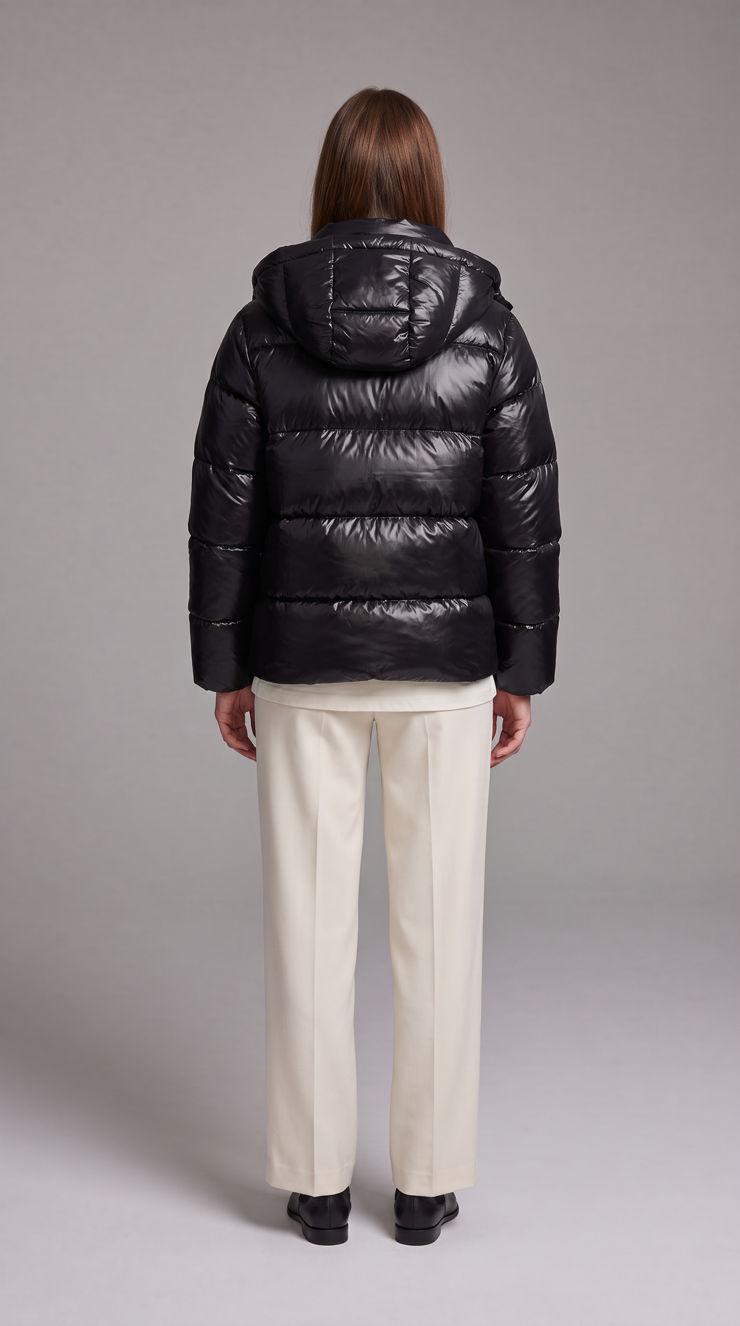Women's hooded quilted puffer coat with long sleeves and front zipper