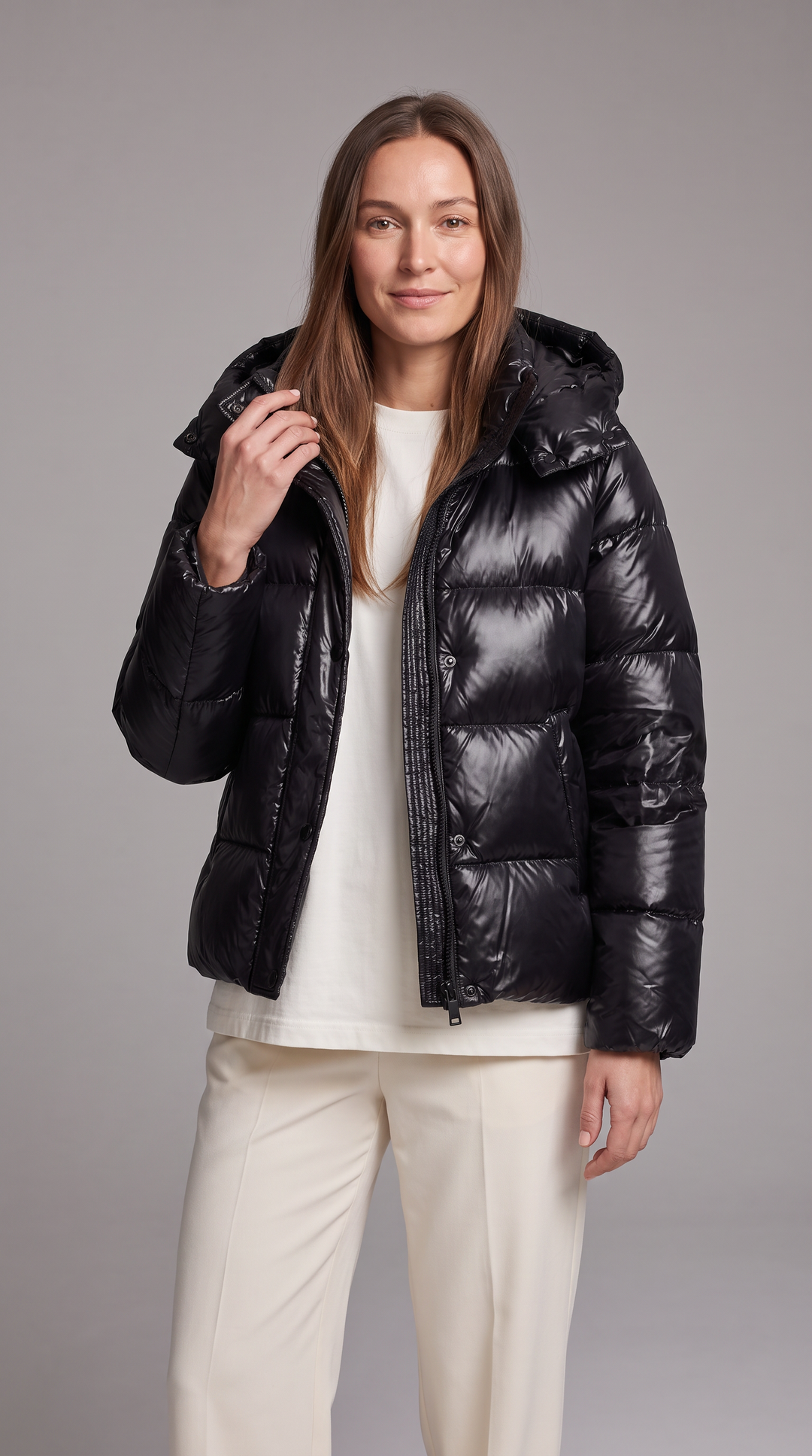 Women's hooded quilted puffer coat with long sleeves and front zipper