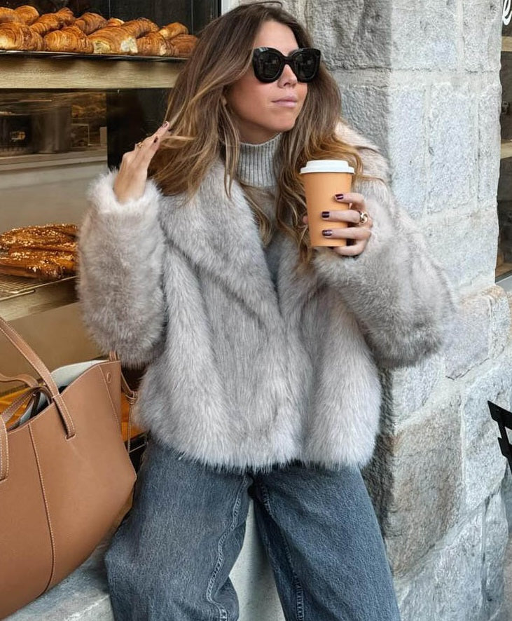 Women's beige faux fur jacket with wide collar and long sleeves