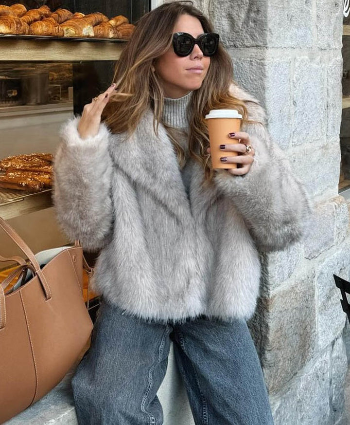 Women's beige faux fur jacket with wide collar and long sleeves