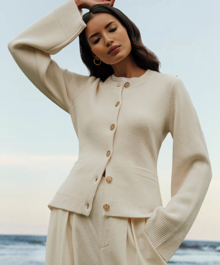 Women's knit cardigan with crew neck, button front, long sleeves and front pockets