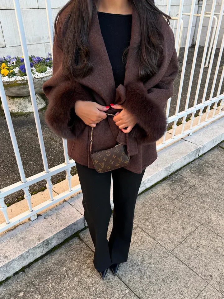Women's wrap coat with tie belt and fur-trimmed cuffs