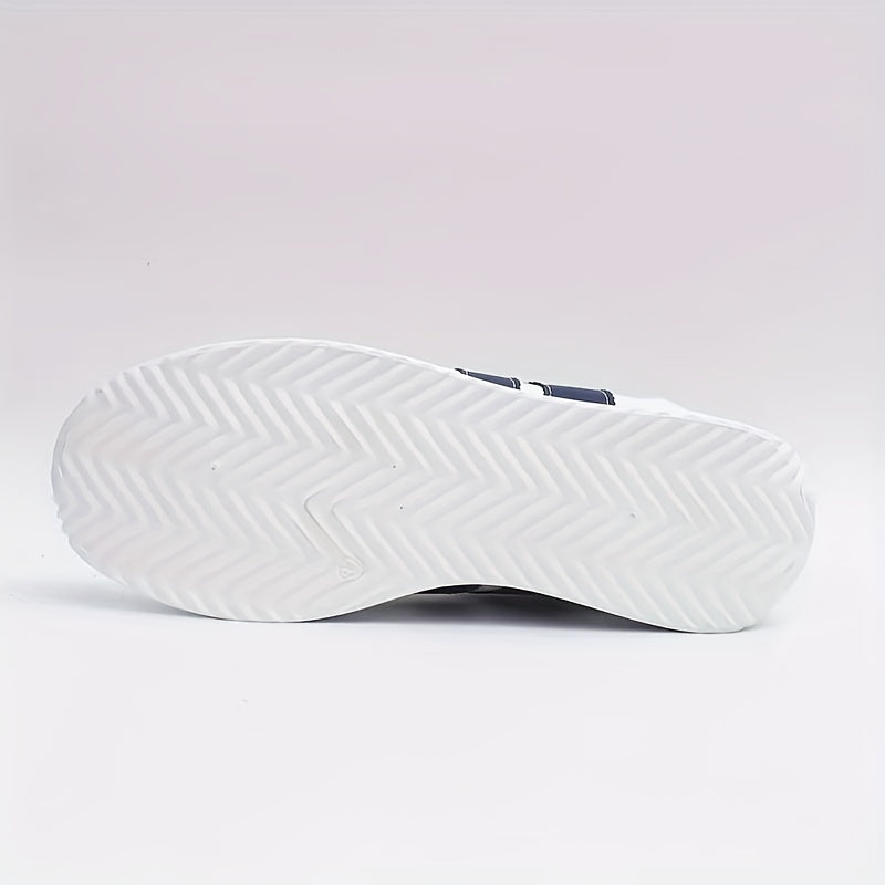 White low-top sneakers with navy side stripes and lace-up fronts
