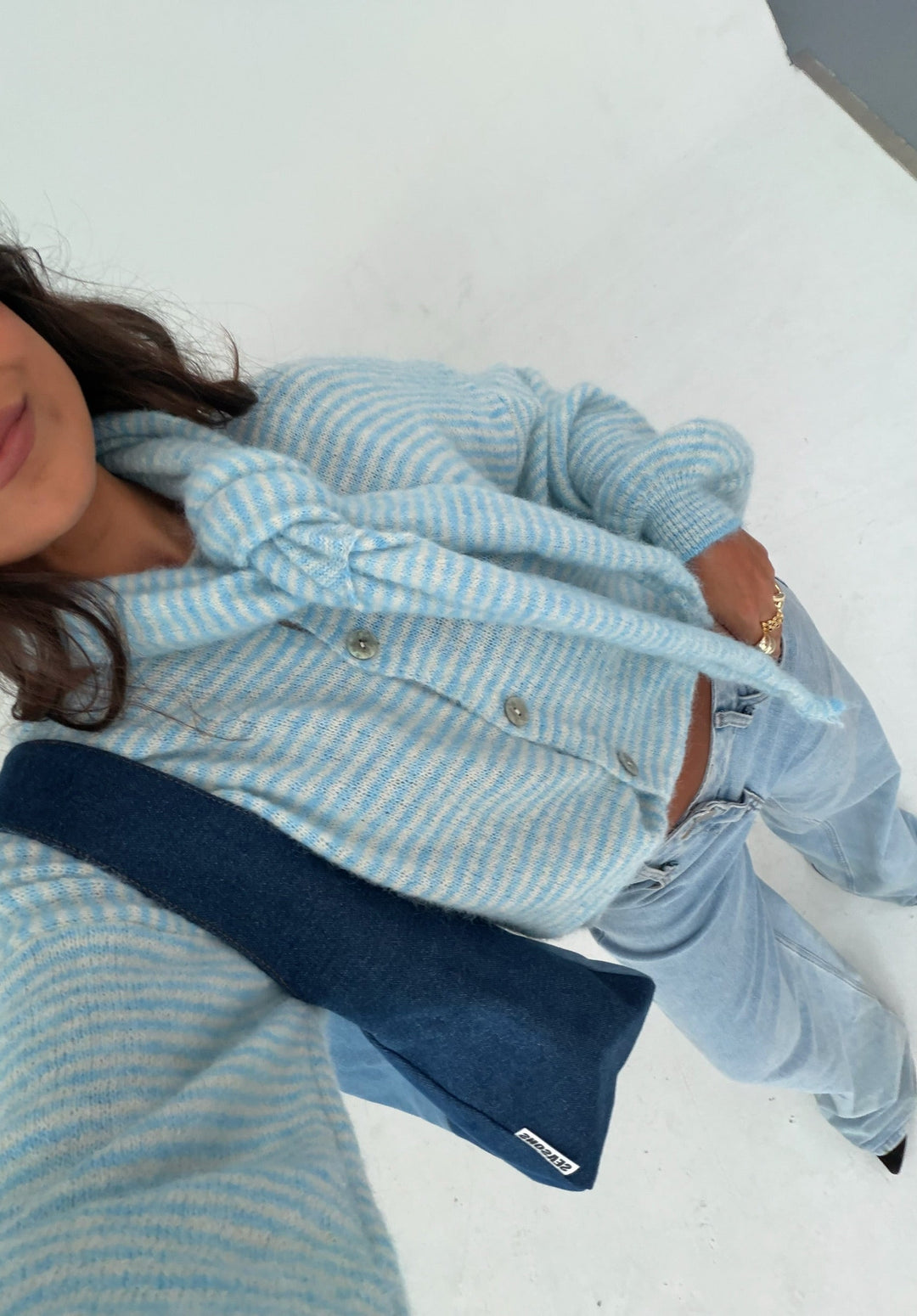 Women's blue striped button-front cardigan with matching scarf