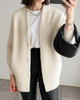 Women's longline button-front cardigan with long sleeves and round neckline