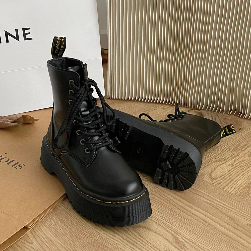 Black women's combat ankle boots with laces, side zips and platform lug soles
