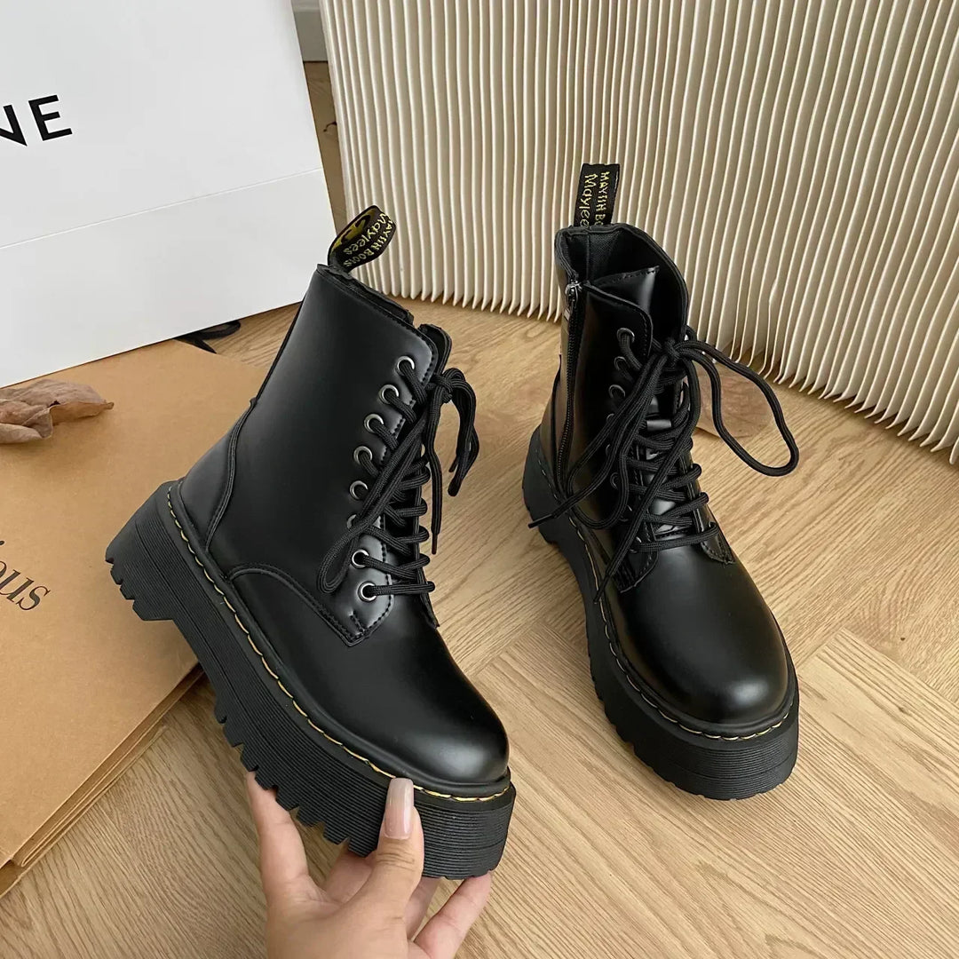 Black women's combat ankle boots with laces, side zips and platform lug soles