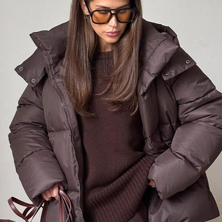 Women's hooded quilted puffer winter coat with long sleeves and zip front