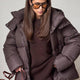 Women's hooded quilted puffer winter coat with long sleeves and zip front