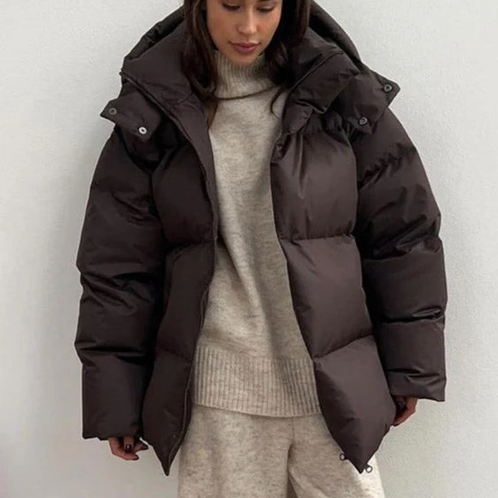 Women's hooded quilted puffer winter coat with long sleeves and zip front