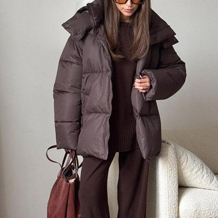 Women's hooded quilted puffer winter coat with long sleeves and zip front