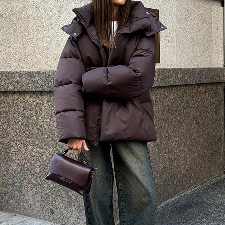 Women's hooded quilted puffer winter coat with long sleeves and zip front