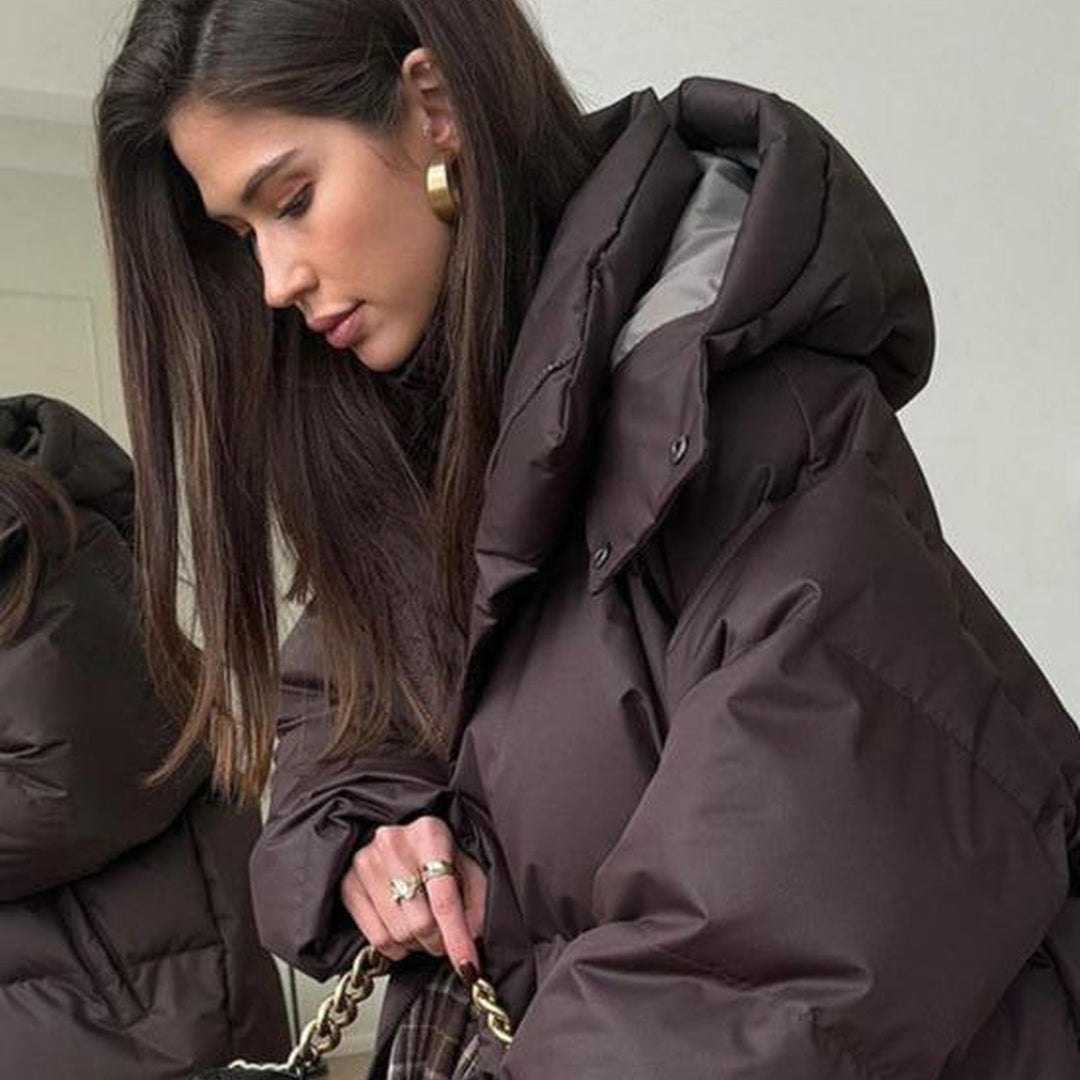 Women's hooded quilted puffer winter coat with long sleeves and zip front