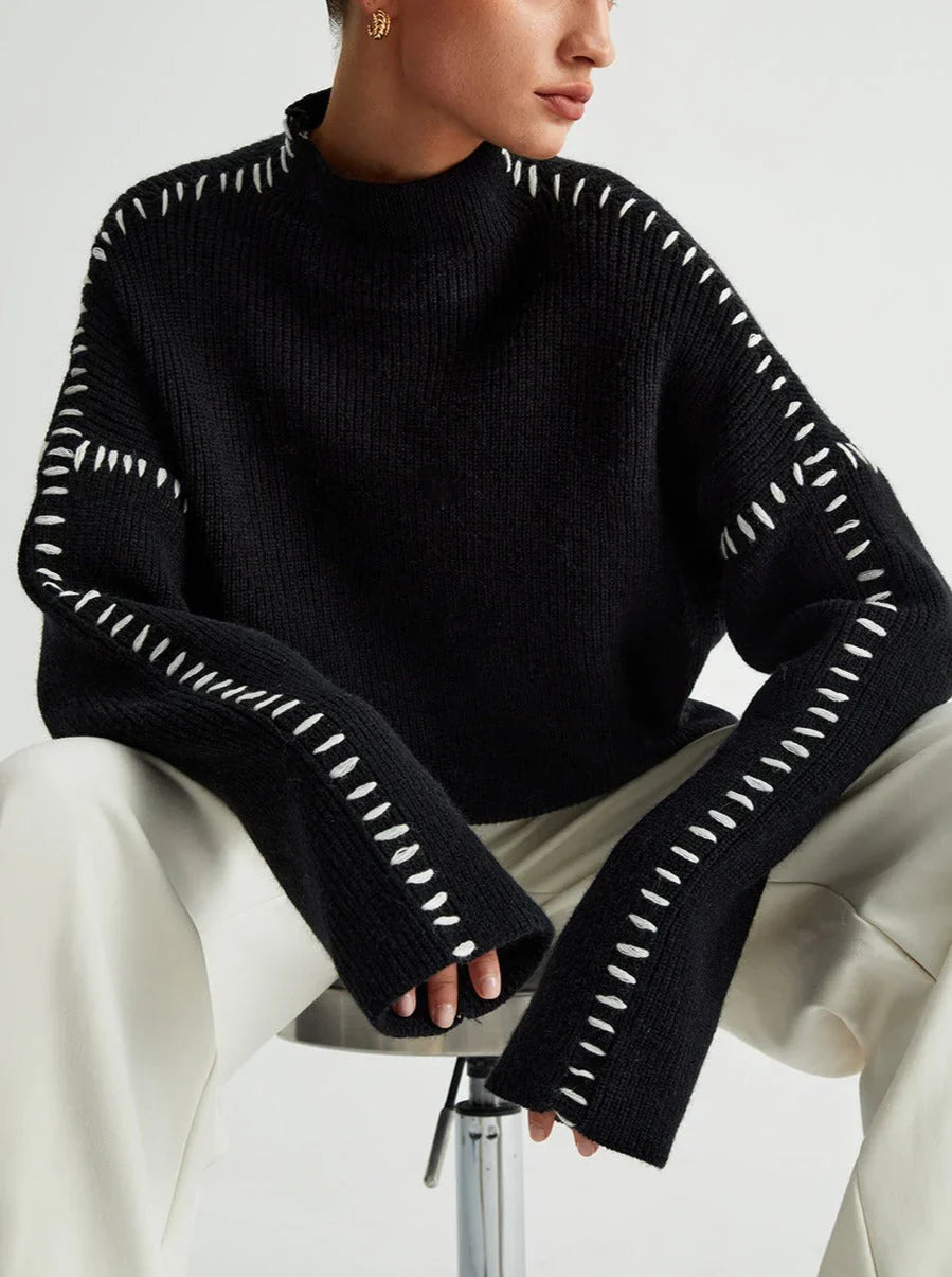 Women's ribbed knit sweater with contrast stitch trim on the sleeves and hem