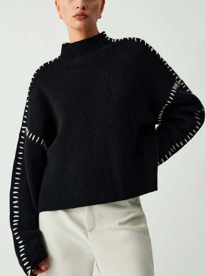 Women's ribbed knit sweater with contrast stitch trim on the sleeves and hem