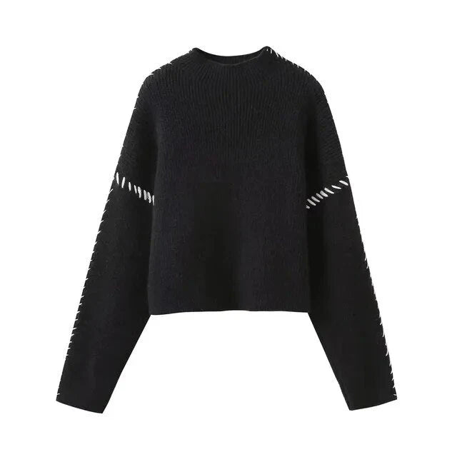 Women's ribbed knit sweater with contrast stitch trim on the sleeves and hem