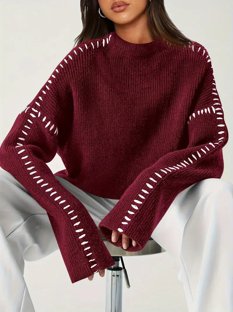 Women's ribbed knit sweater with contrast stitch trim on the sleeves and hem