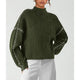 Women's ribbed knit sweater with contrast stitch trim on the sleeves and hem