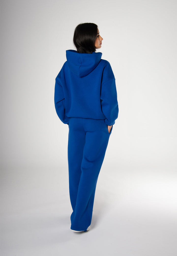 Women's blue pullover hoodie with white chest logo and hood