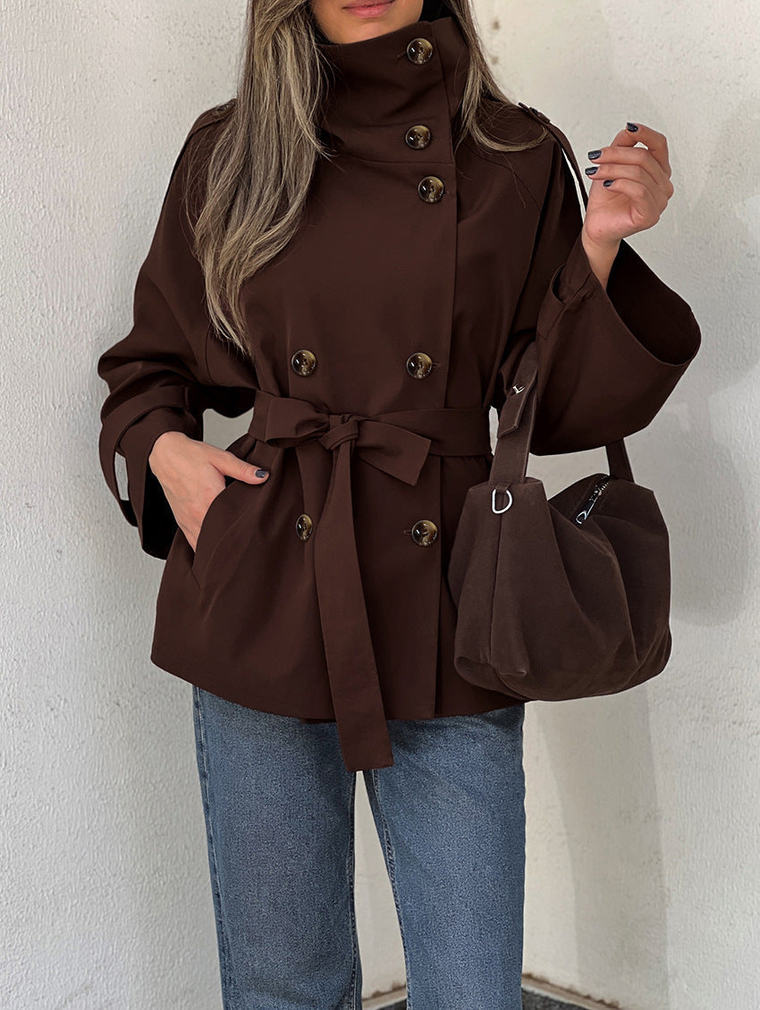 Women's brown double-breasted trench jacket with high collar and tied waist belt