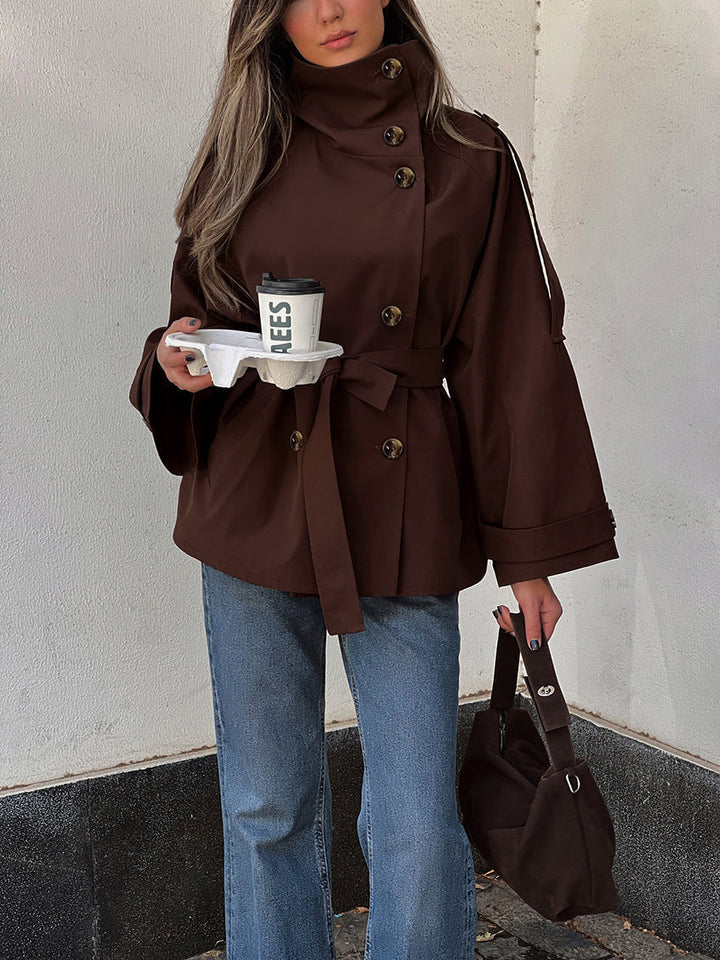 Women's brown double-breasted trench jacket with high collar and tied waist belt