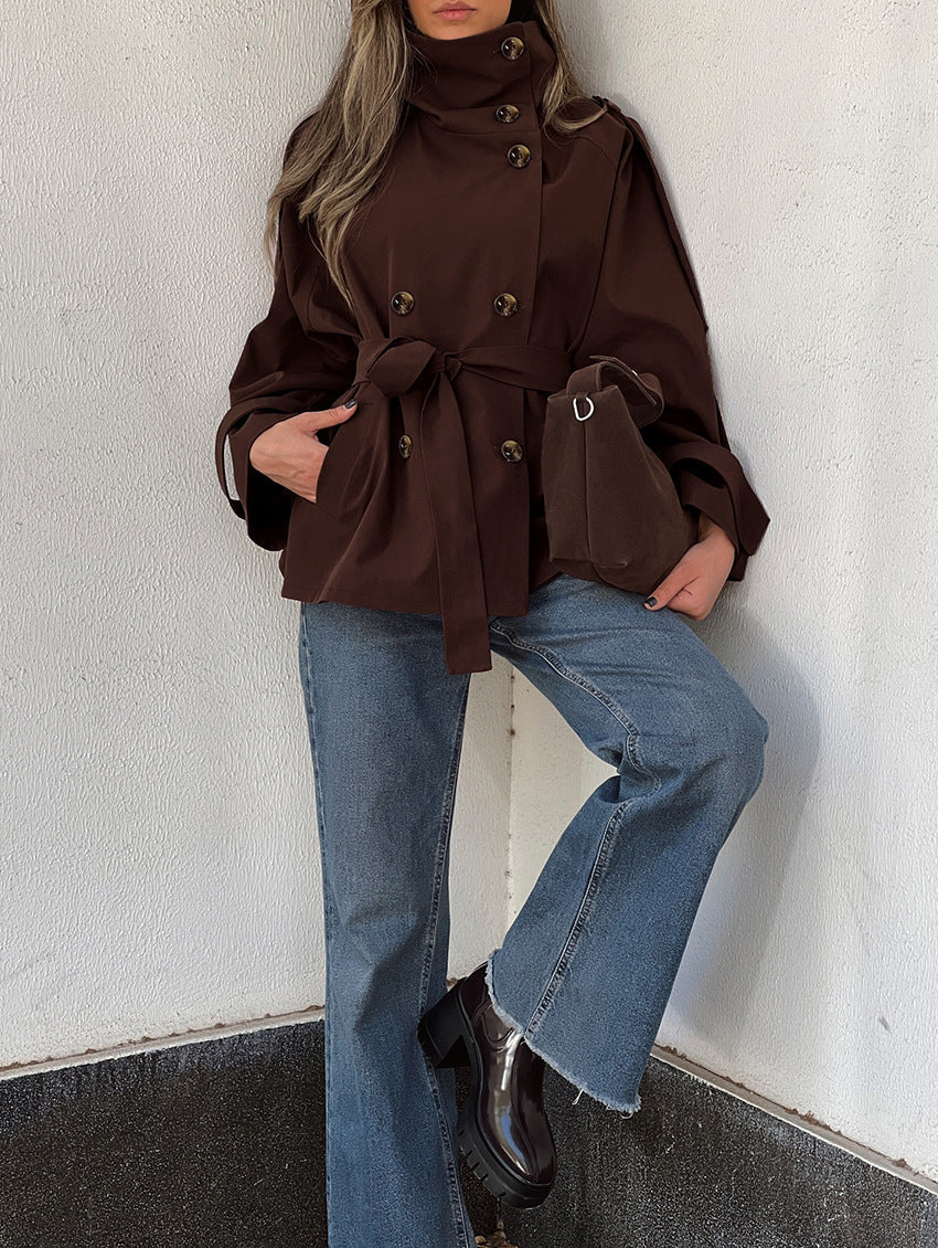 Women's brown double-breasted trench jacket with high collar and tied waist belt