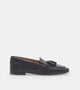 Women's black slip-on loafers with tassel trim and low heel