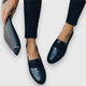 Black women's loafers with crocodile-embossed vamp and penny strap