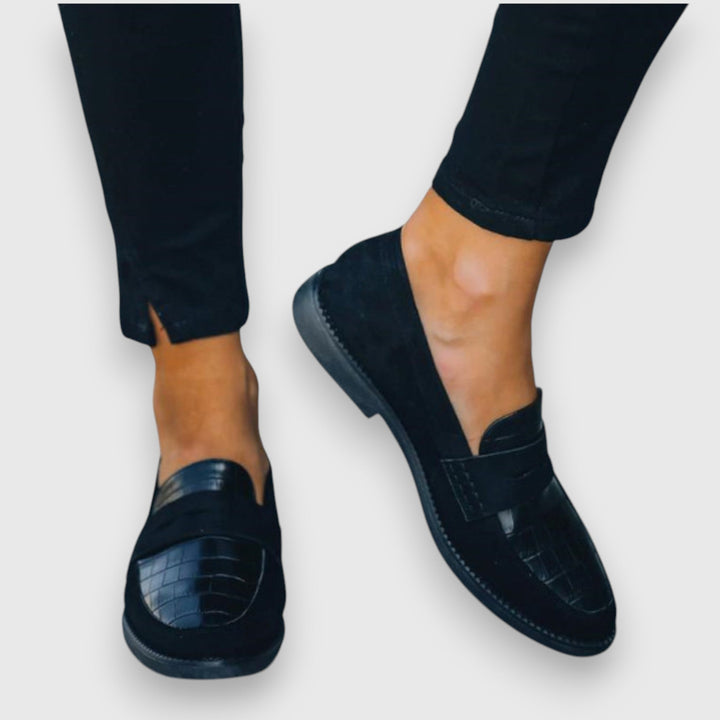 Black women's loafers with crocodile-embossed vamp and penny strap