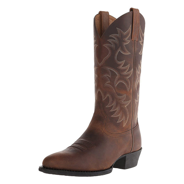 Tall embroidered cowboy boots with pointed toes and low heels