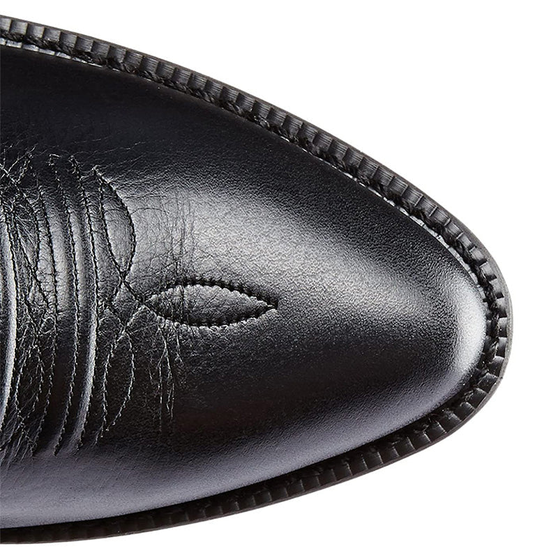 Tall embroidered cowboy boots with pointed toes and low heels