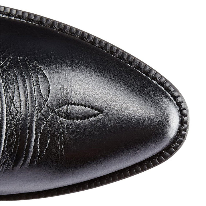 Tall embroidered cowboy boots with pointed toes and low heels