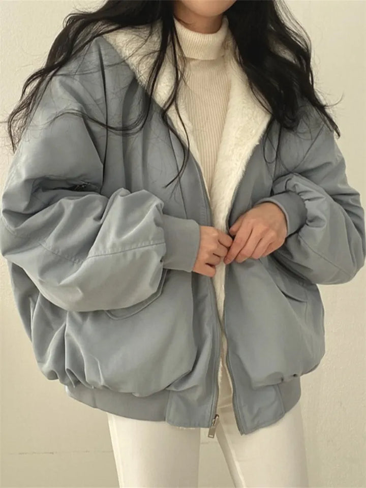 Women's relaxed bomber jacket with sherpa-style lining, zip front and flap pockets