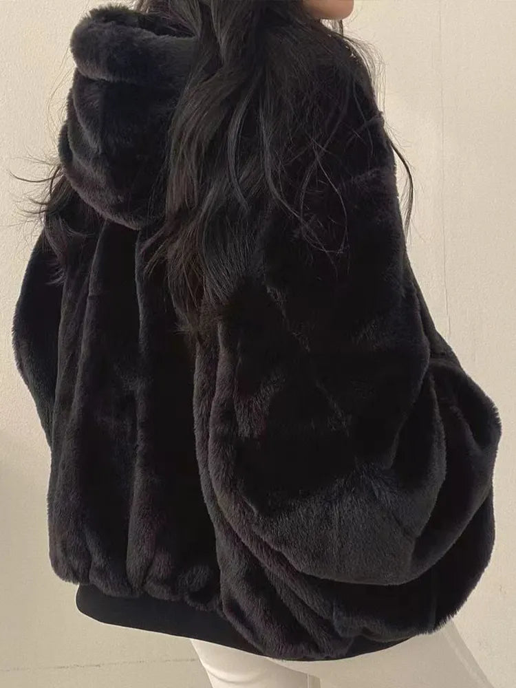 Women's relaxed bomber jacket with sherpa-style lining, zip front and flap pockets