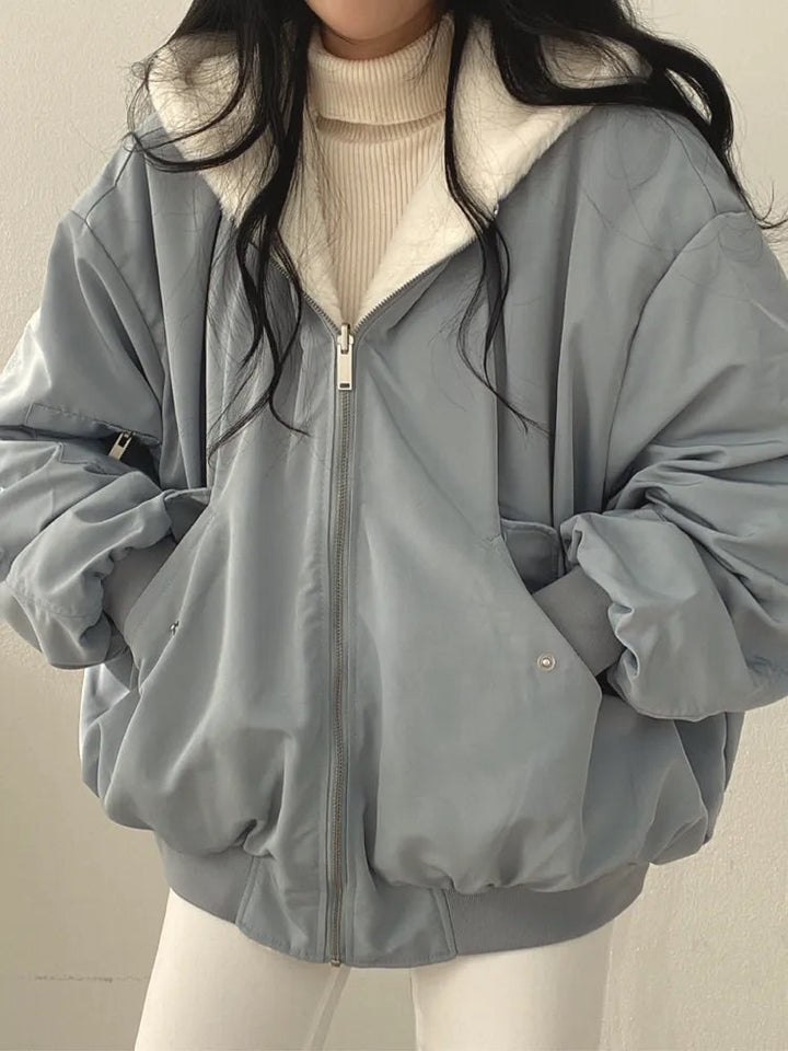 Women's relaxed bomber jacket with sherpa-style lining, zip front and flap pockets