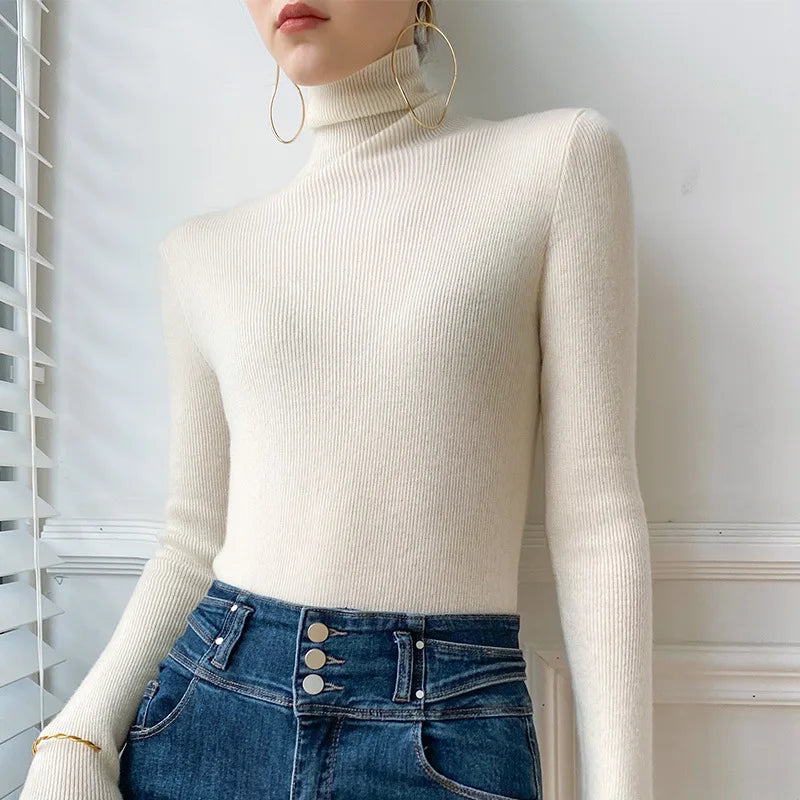 Women's ribbed turtleneck sweater with long sleeves and fitted hip-length cut