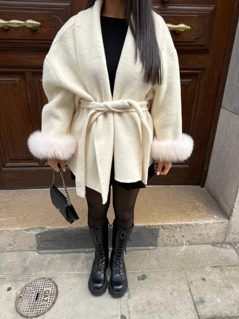 Women's wrap coat with tie belt and fur-trimmed cuffs