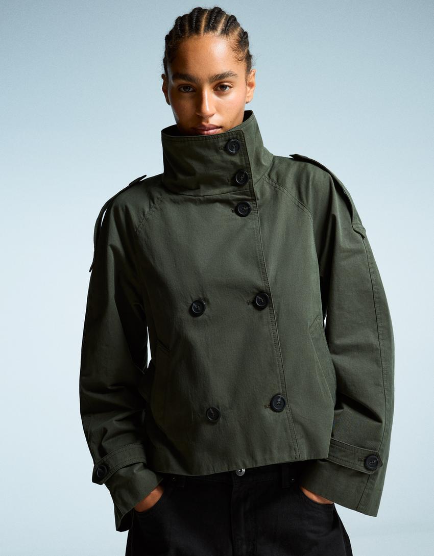 Women's short trench jacket with high collar, buttons, belt and long sleeves