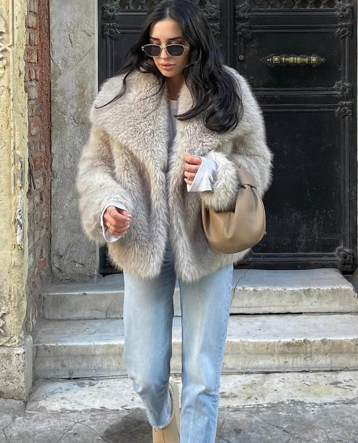 Women's beige faux fur jacket with wide collar and long sleeves