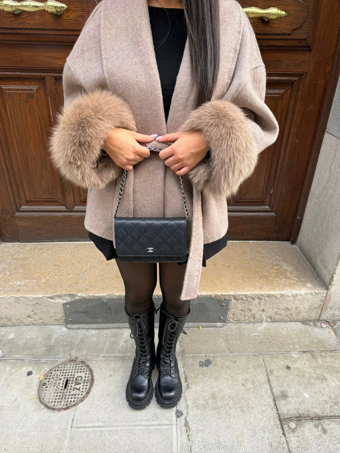 Women's wrap coat with tie belt and fur-trimmed cuffs