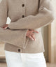 Women's knit cardigan with crew neck, button front, long sleeves and front pockets