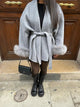 Women's wrap coat with tie belt and fur-trimmed cuffs