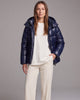Women's hooded quilted puffer coat with long sleeves and front zipper