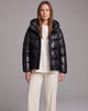Women's hooded quilted puffer coat with long sleeves and front zipper