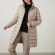 Women's quilted puffer jacket with high collar, long sleeves and zipped pockets