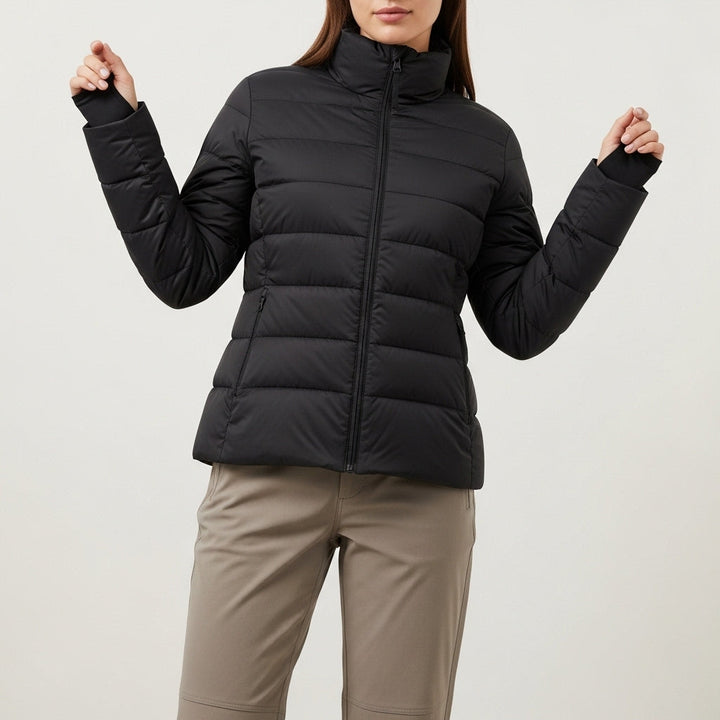 Women's quilted puffer jacket with high collar, long sleeves and zipped pockets