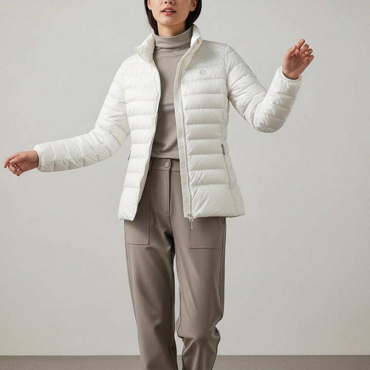 Women's quilted puffer jacket with high collar, long sleeves and zipped pockets