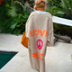 Women's oversized longline cardigan with LOVE PEACE graphic on the back