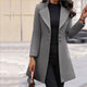 Women's longline tailored coat with notched lapels and button front